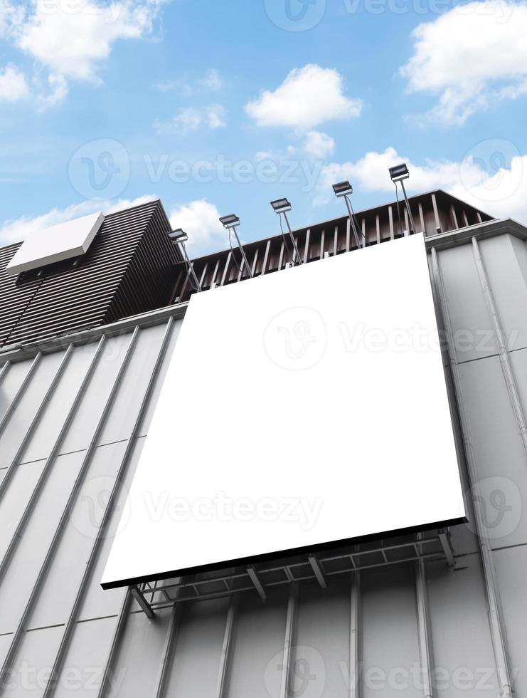 Mock up white background billboard on building with blue sky background. clipping path for Mockup photo