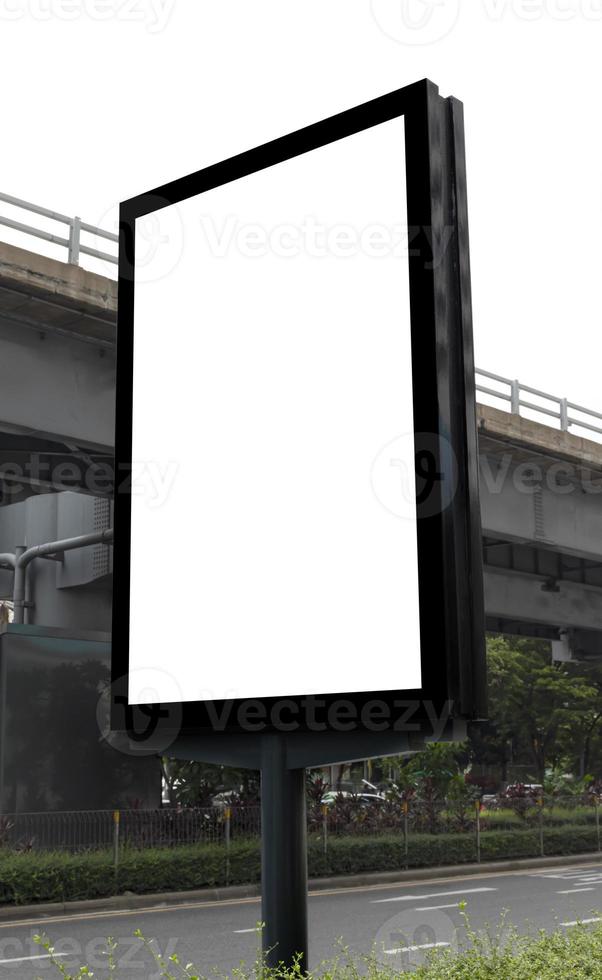 Outdoor pole billboard with mock up white screen on city view background and clipping path photo