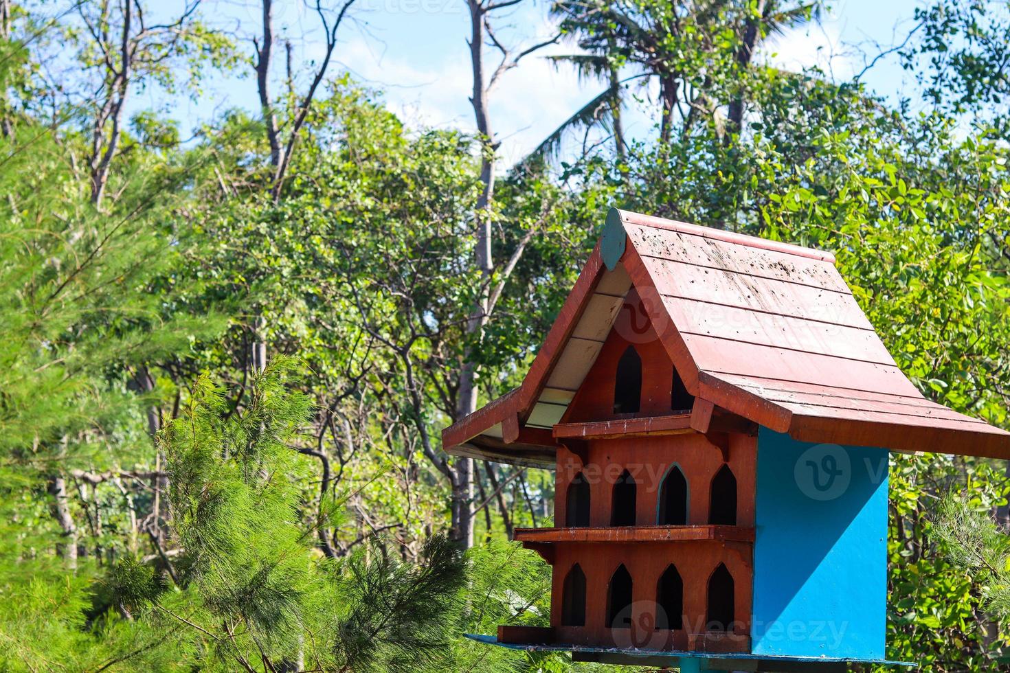 the dove house is made of wood and placed on a height. in Java known as pagupon photo