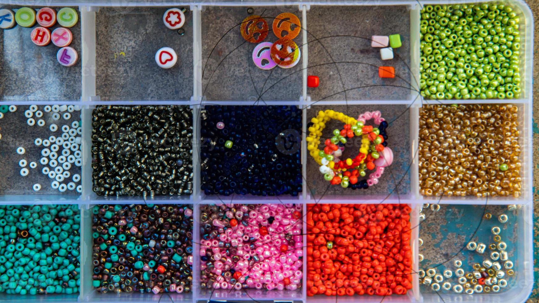 A creative set of various beautiful sewing handmade materials .beads weaving. photo