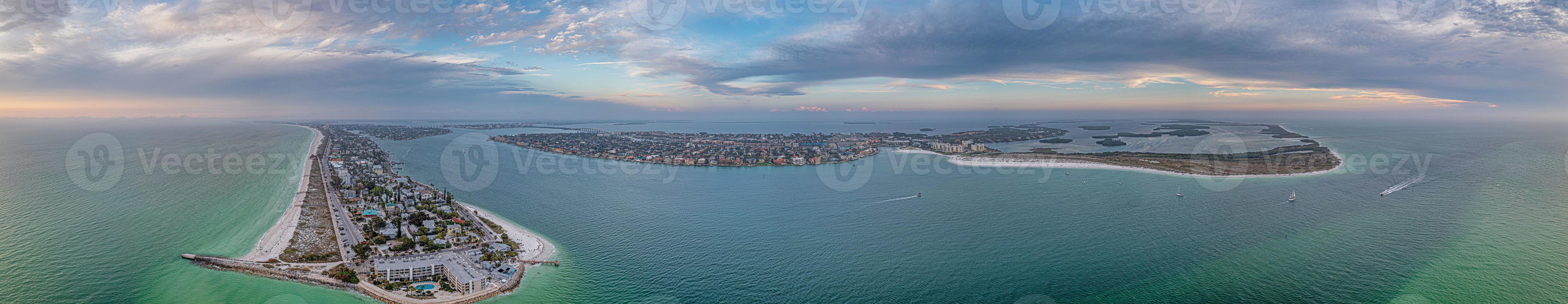 Drone panorama over Pass-a-Grille beach on Treasure Island and Pine Key area in St. Petersburg in Florida during sunset photo