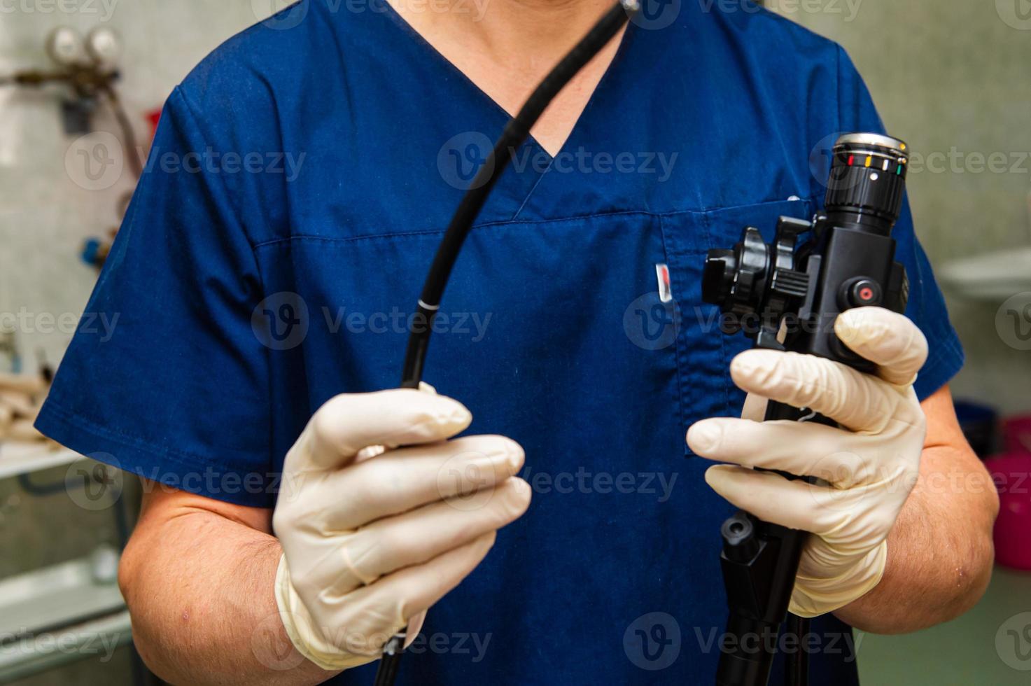 Endoscope in the hands of doctor. Medical instruments used in gastroscopy.Gastric probe photo