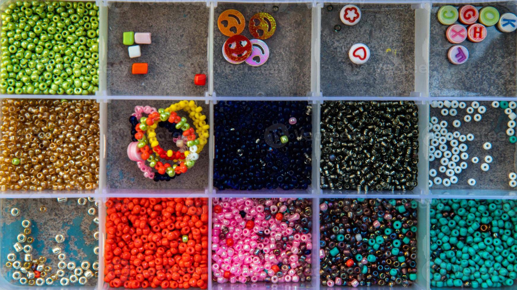 A creative set of various beautiful sewing handmade materials .beads weaving. photo