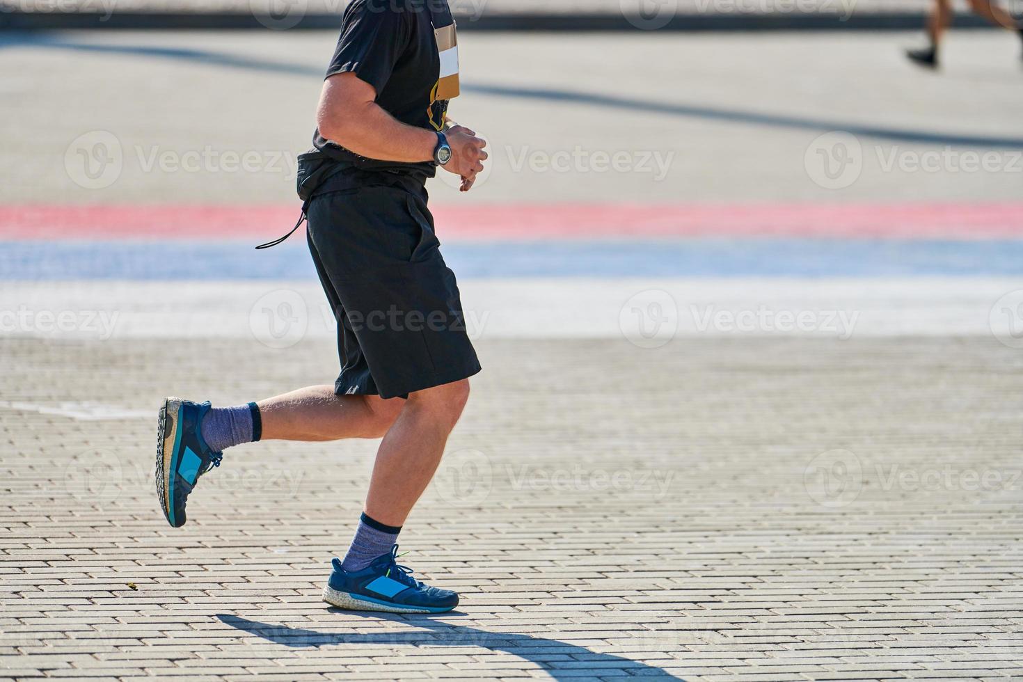 Running athletic man. photo