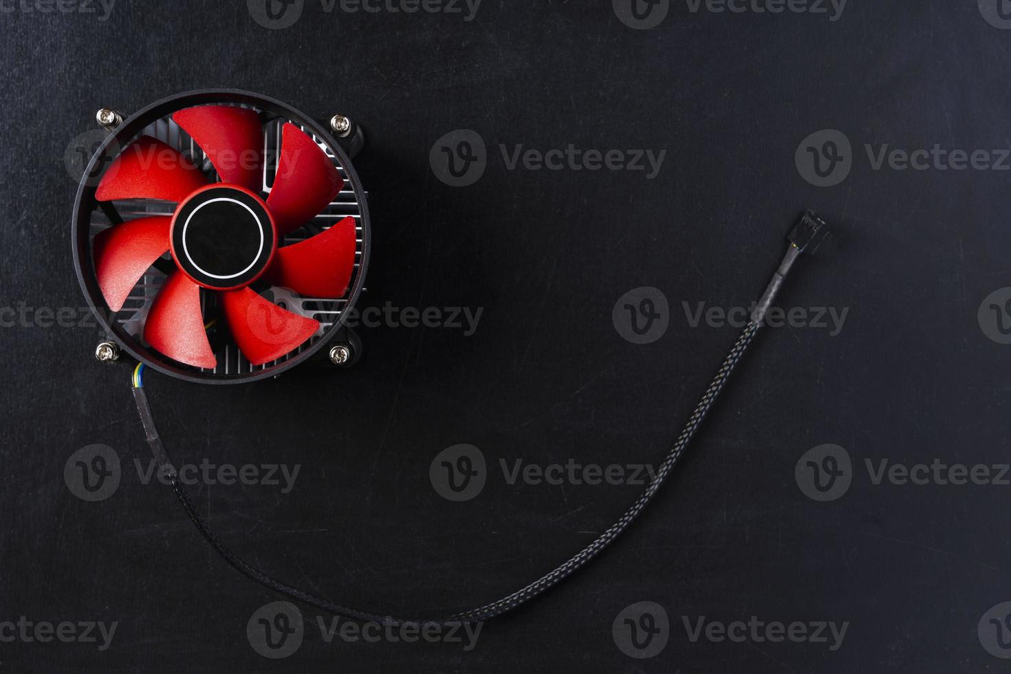Computer cooler, top view of a computer processor cooler on a black background photo