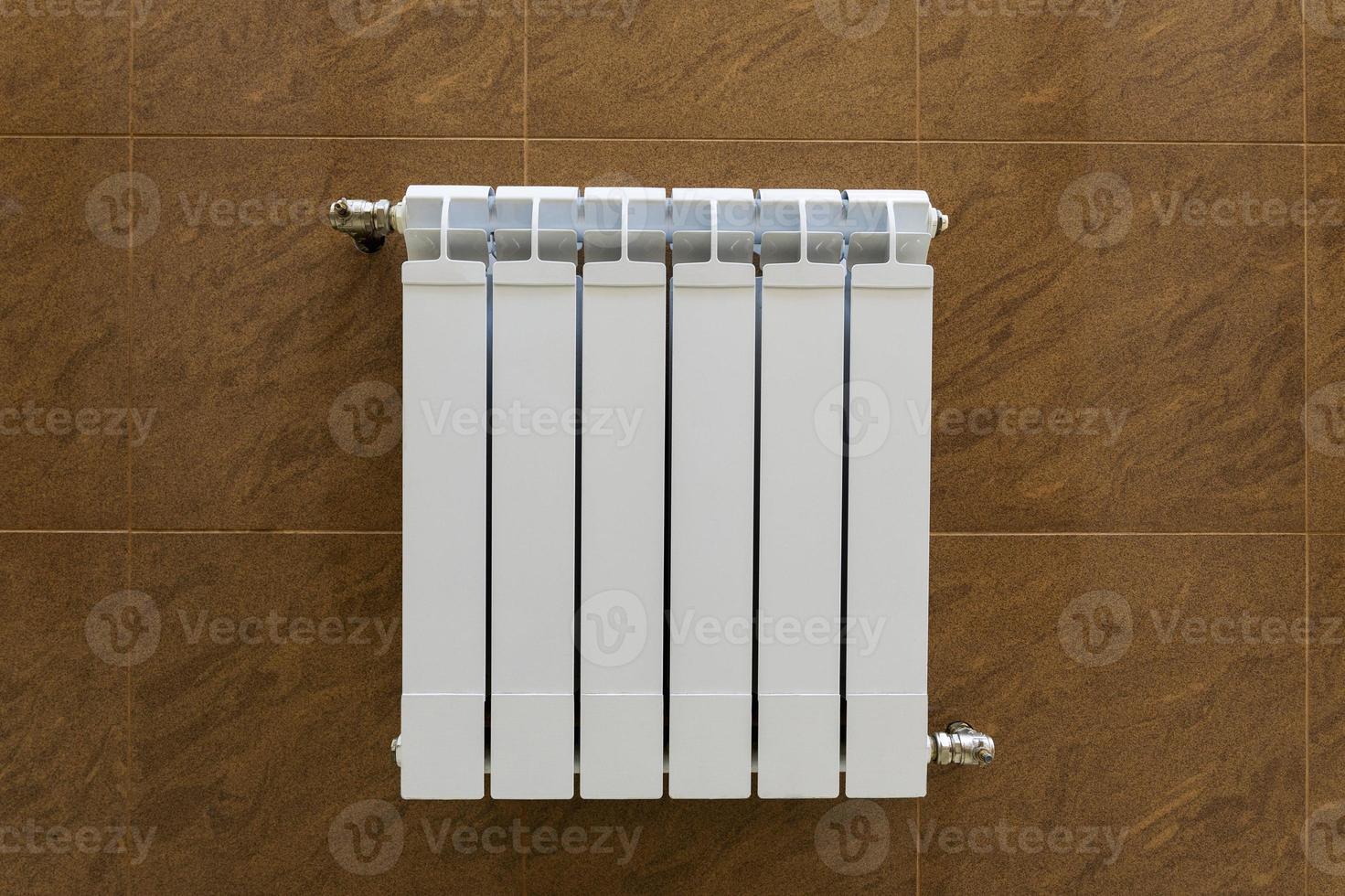 modern sectional radiator for heating the heating system on the wall, warmth and comfort in the house photo