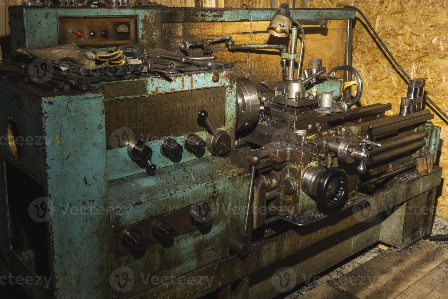 Old metal lathe in the workshop, metalworking, machine tools photo