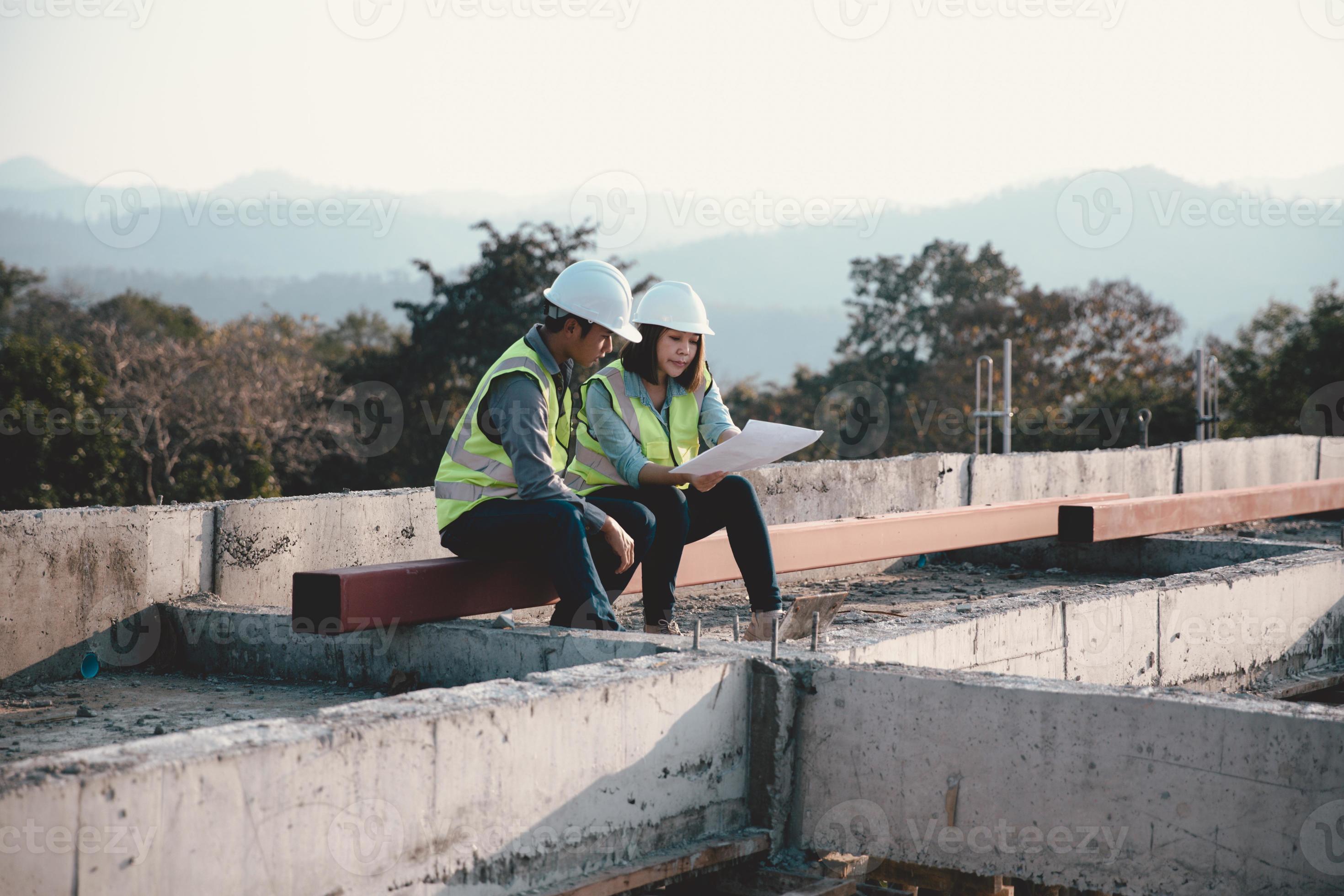 Two specialists inspect commercial, Industrial building construction