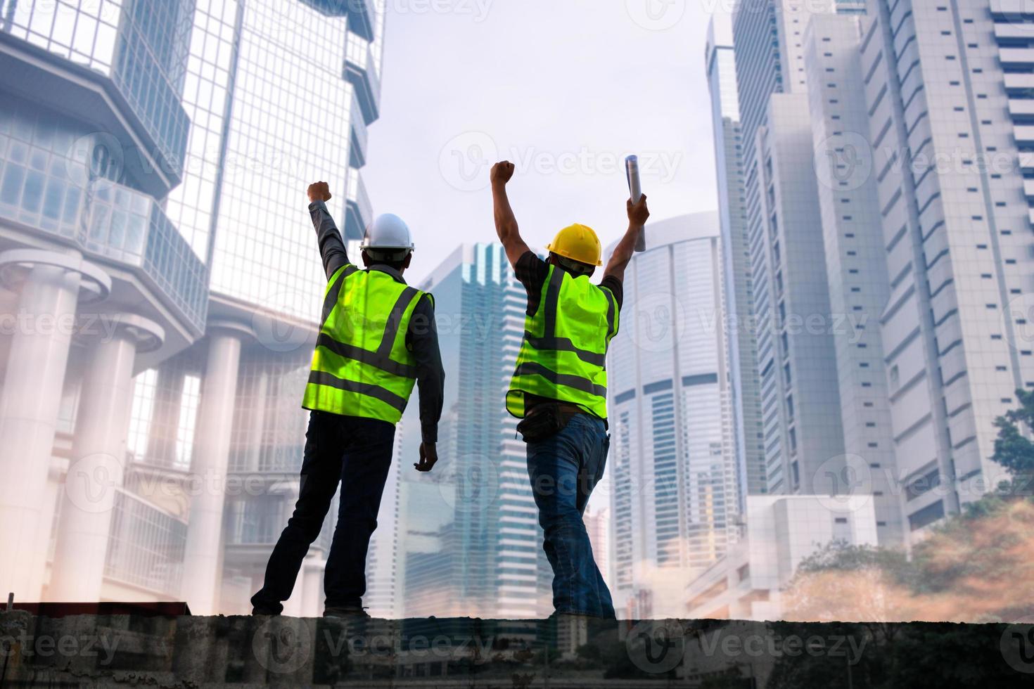 Double exposure image of engineer civil and construction worker with safety helmet and construction drawing against the background of surreal construction site in the night city or dark cityscape. photo