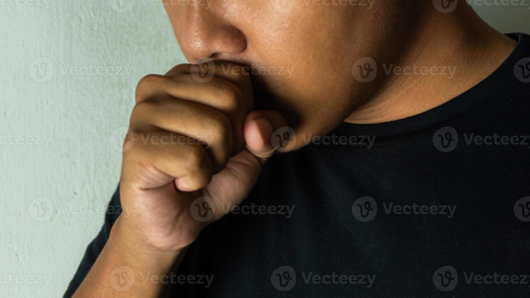 close up of man coughing. medical and healthcare concept. coughing because cold and bronchitis photo
