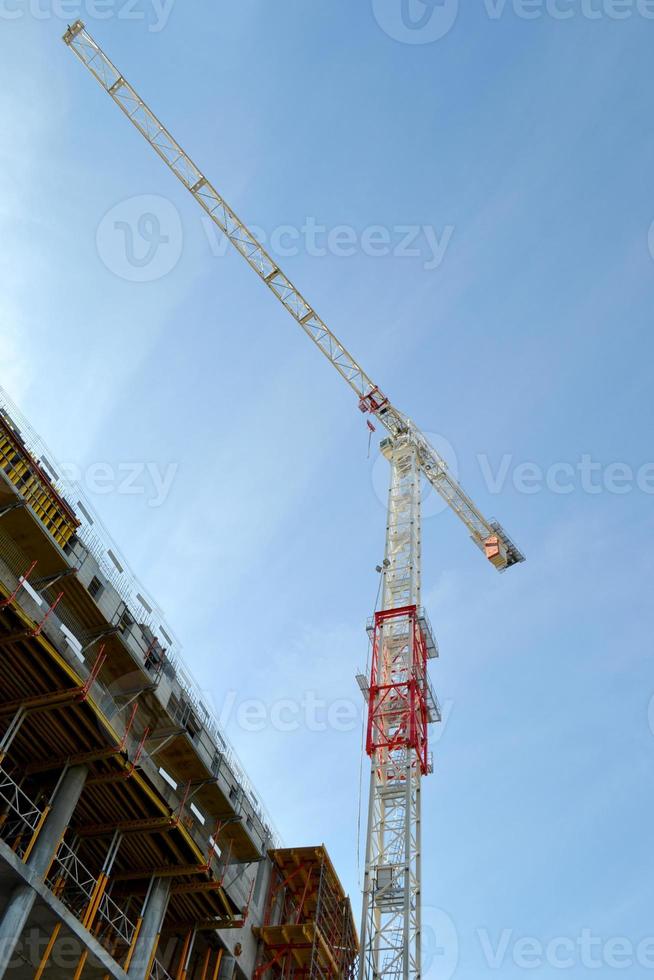 Construction of an Office Building with Concrete Support Pillars and Crane photo