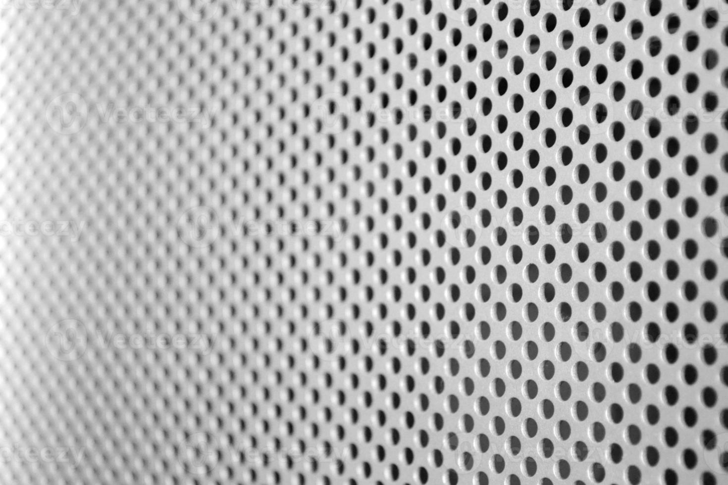 Metal Texture with Many Tiny Round Wholes photo