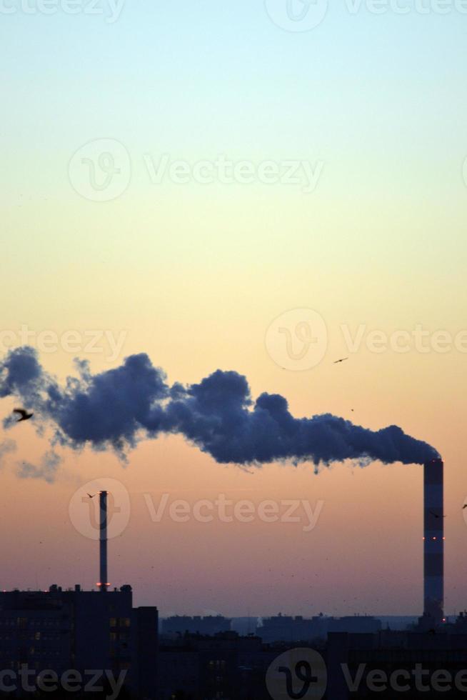 Smoke Coming From Factory Chimney at Sunset photo