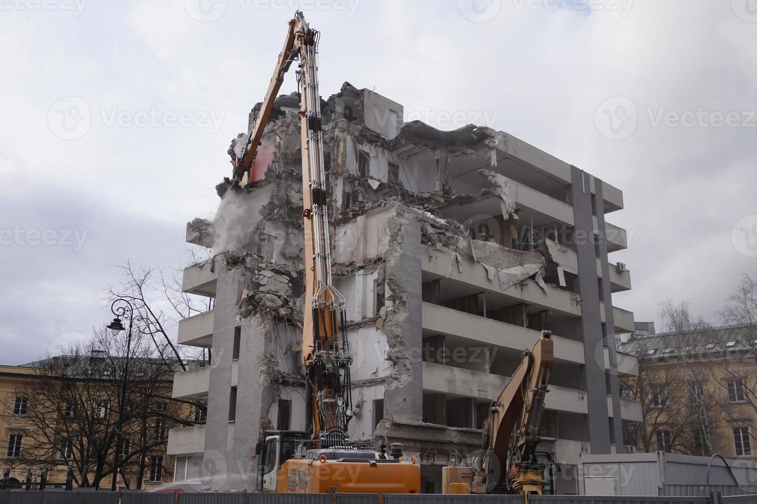 Multistorey Building Demolished and Dismantled by Machine photo