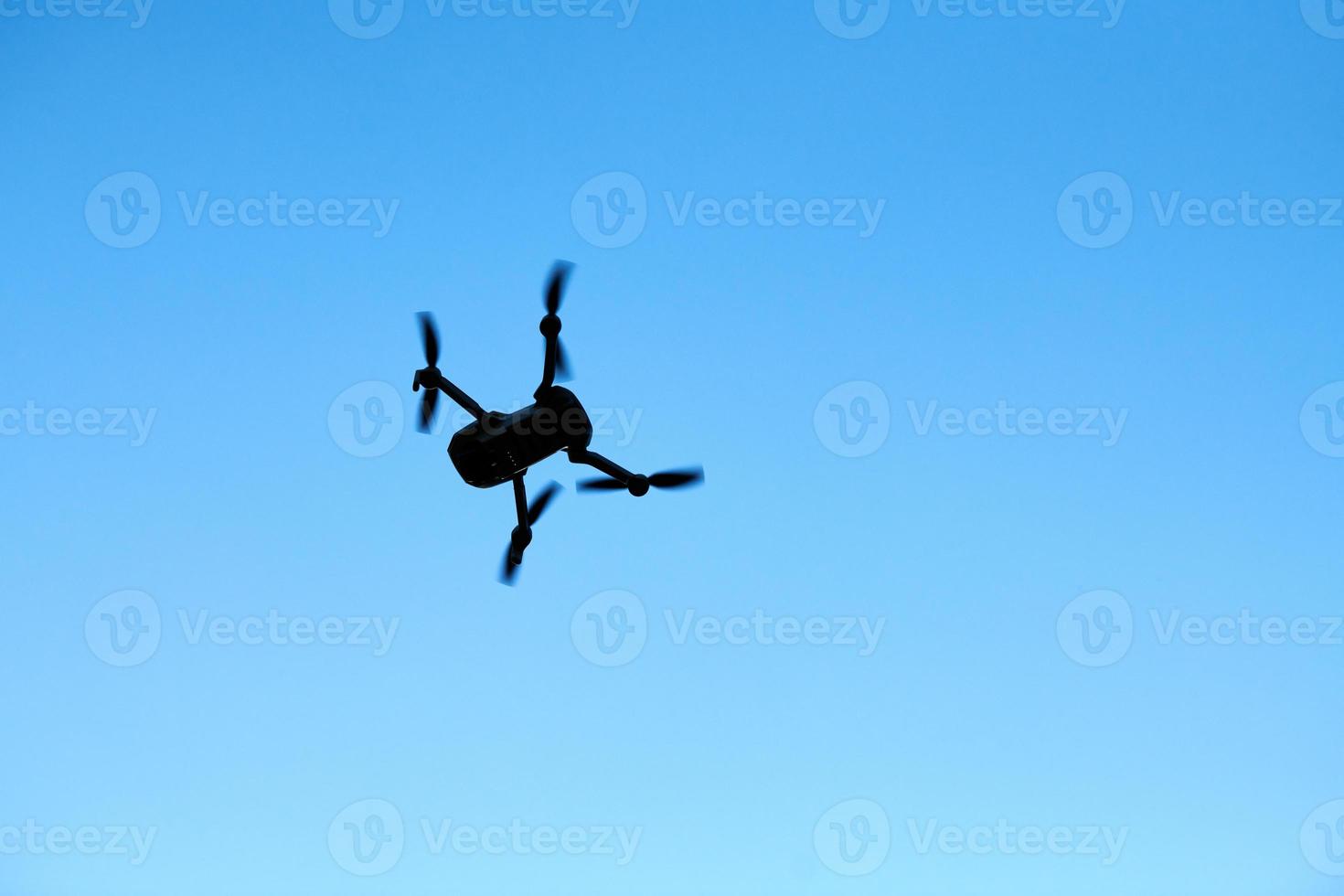 Quadcopter drone in sky photo