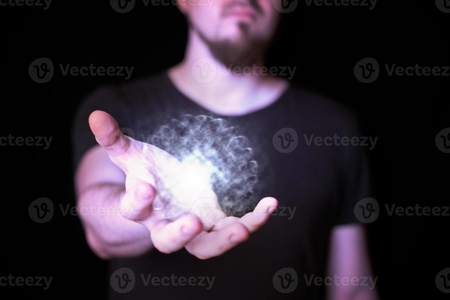 Magic ball in bearded wizard hand photo
