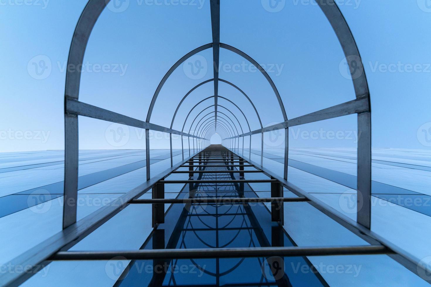 Fire escape staircase. Stairway to Heaven concept. Emergency fire exit. Bottom view photo