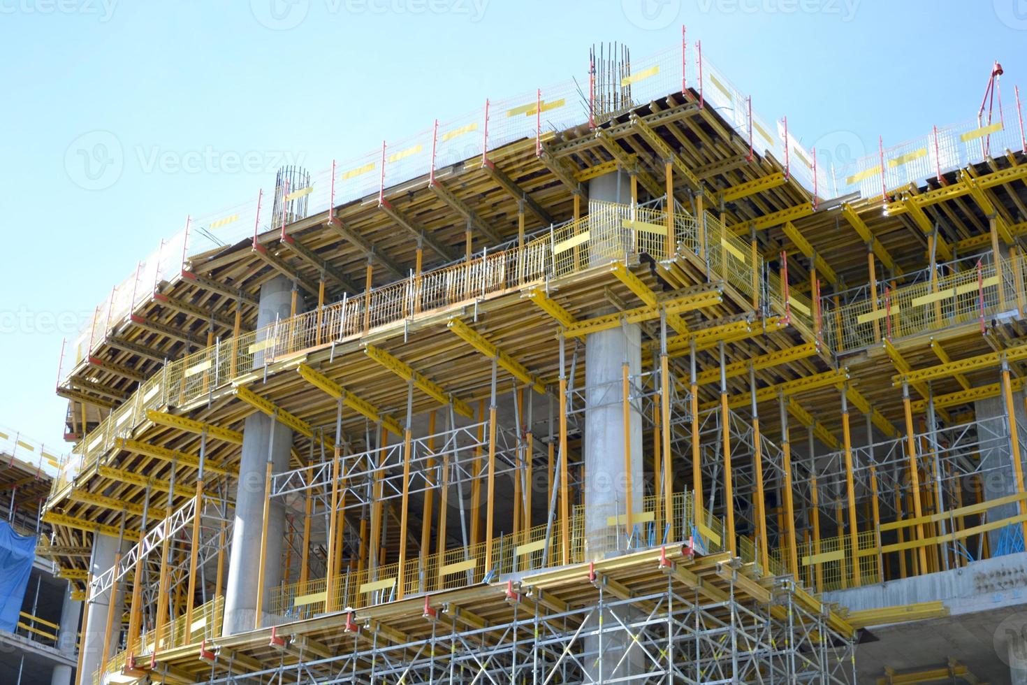 Construction of Multistorey Office Building, Scaffolding and Concrete Support Pillars photo