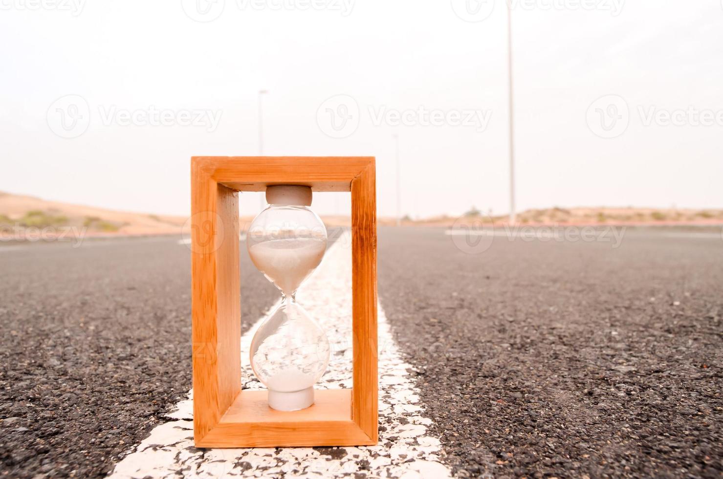 Hour glass on the road photo