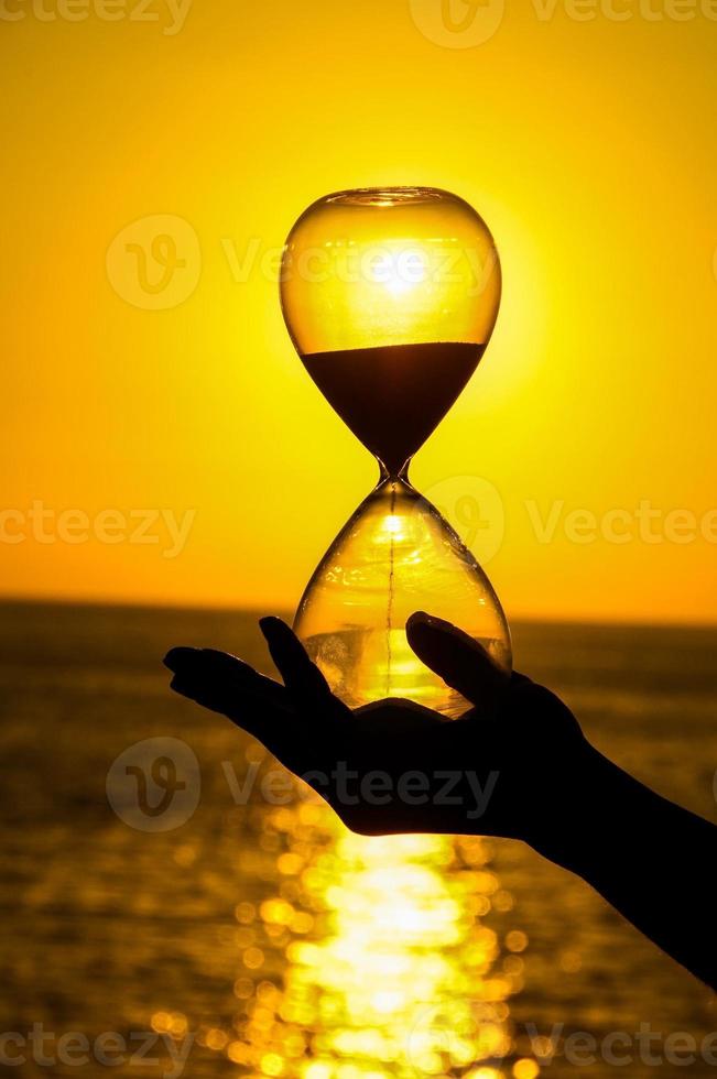 Hourglass over the sunset photo