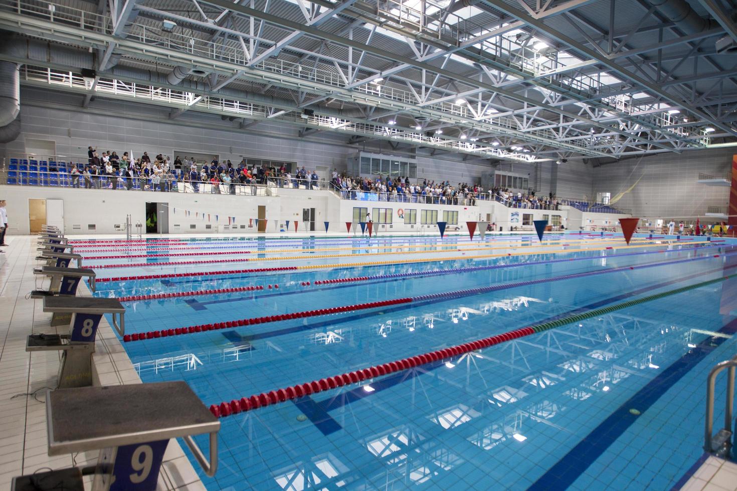 Belarus, city of Gomel, September 03, 2021. City sports pool.View of the pool with lanes and spectators. photo