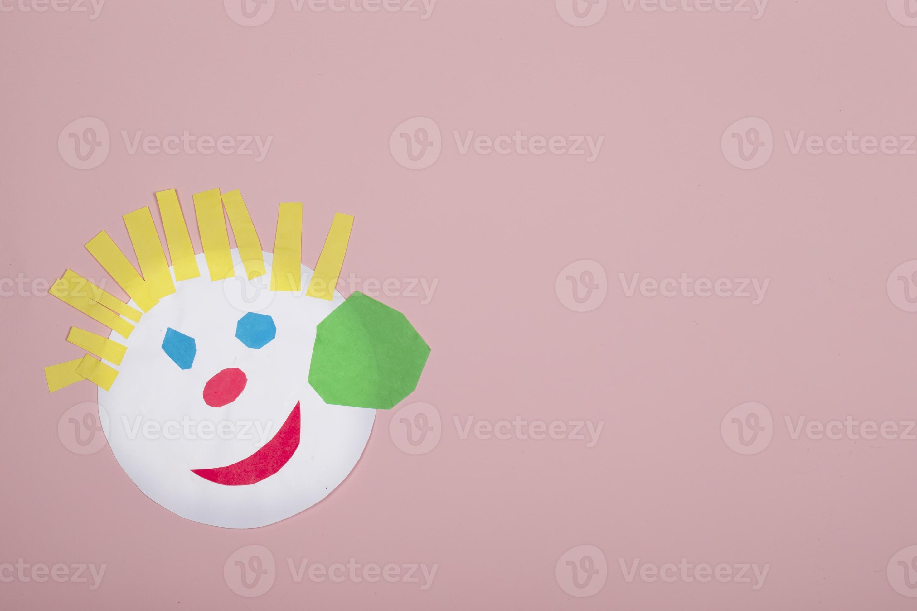 Paper crafts for children. Application of children's creativity.  Kindergarten and craft school. On a beige background, a funny face of a man  made of colored paper. 18906892 Stock Photo at Vecteezy