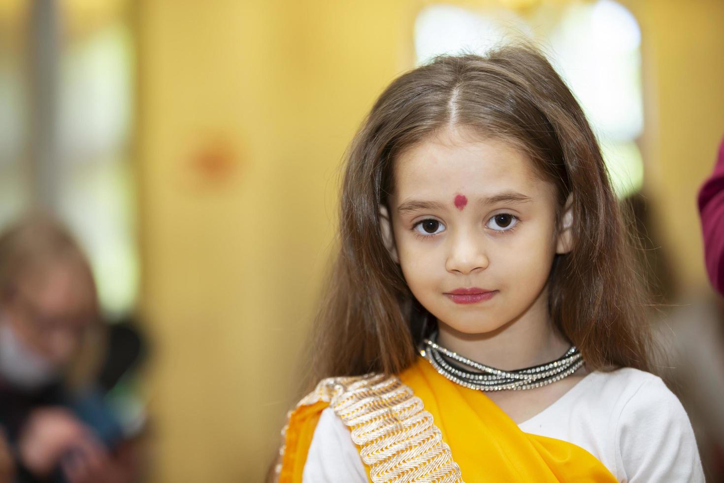 Belarus, city of Gomil, May 21, 2021. People's Friendship Day.Little Indian girl in national dress. photo