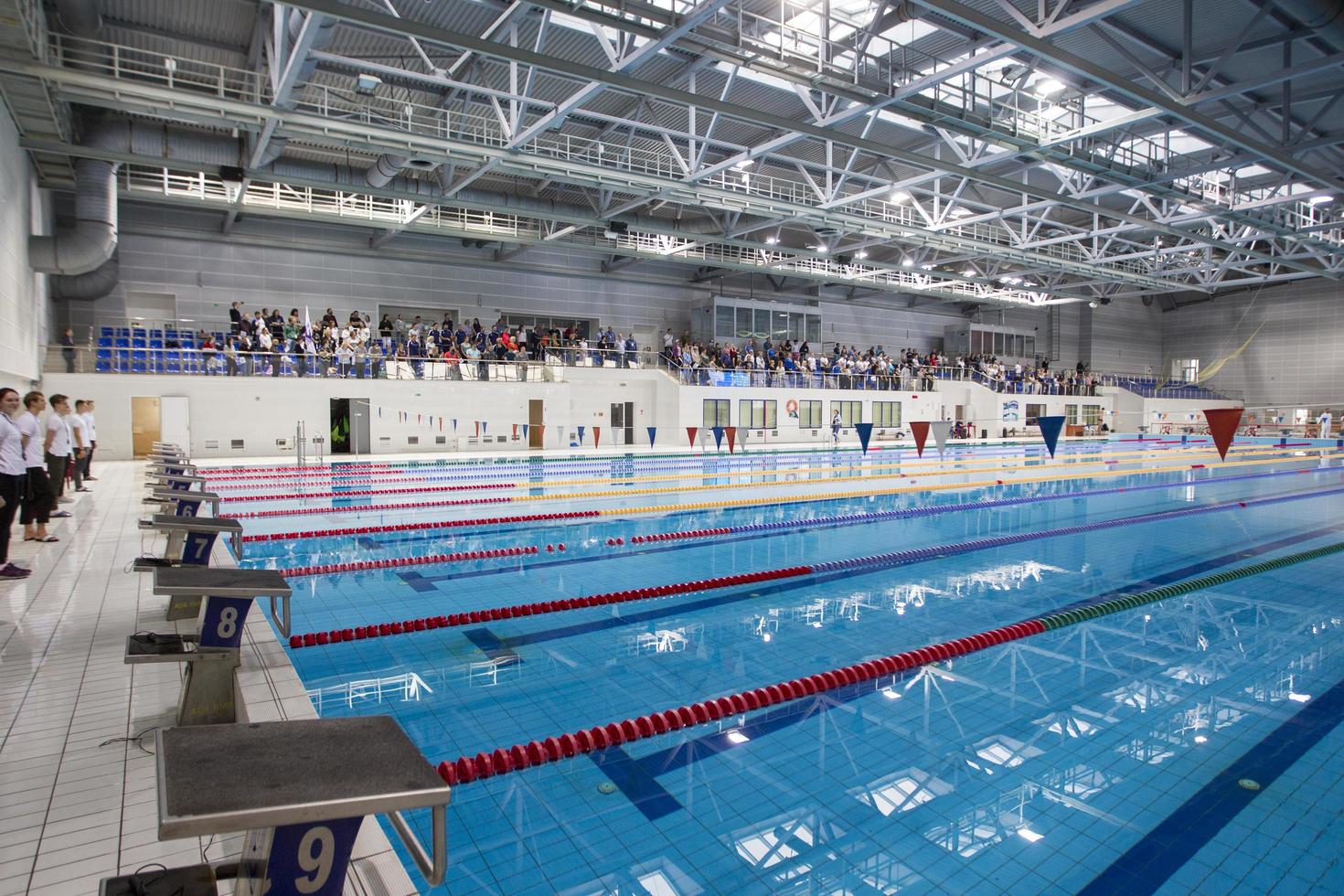 Belarus, city of Gomel, September 03, 2021. City sports pool.View of the pool with lanes and spectators. photo