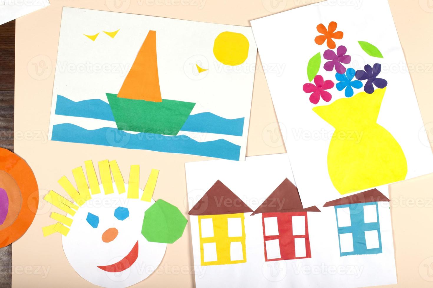 A collage of children's paper crafts. Application of children's creativity. Kindergarten and craft school. photo