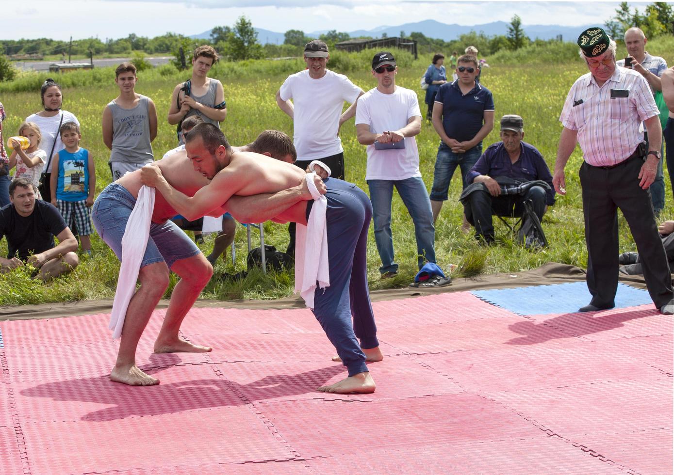 Kamchatka, Russia- 10 June 2021 - Fight kuresh at Sabantuy in the city park. photo