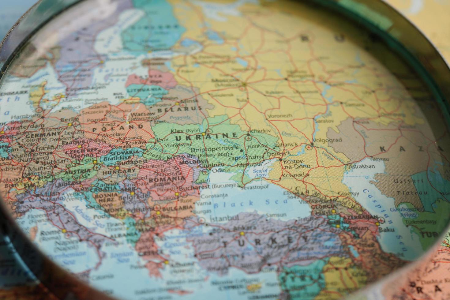 Bangkok, Thailand - May 15, 2022 Magnifying glass on world map. photo