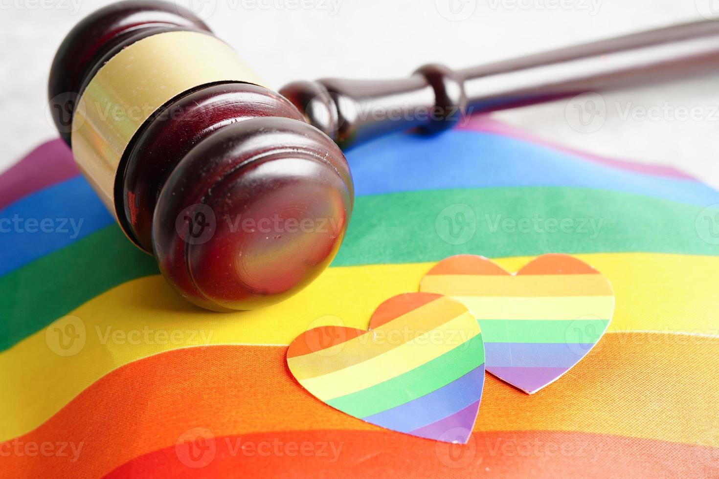 Gavel for judge lawyer with heart rainbow flag, symbol of LGBT pride month. photo