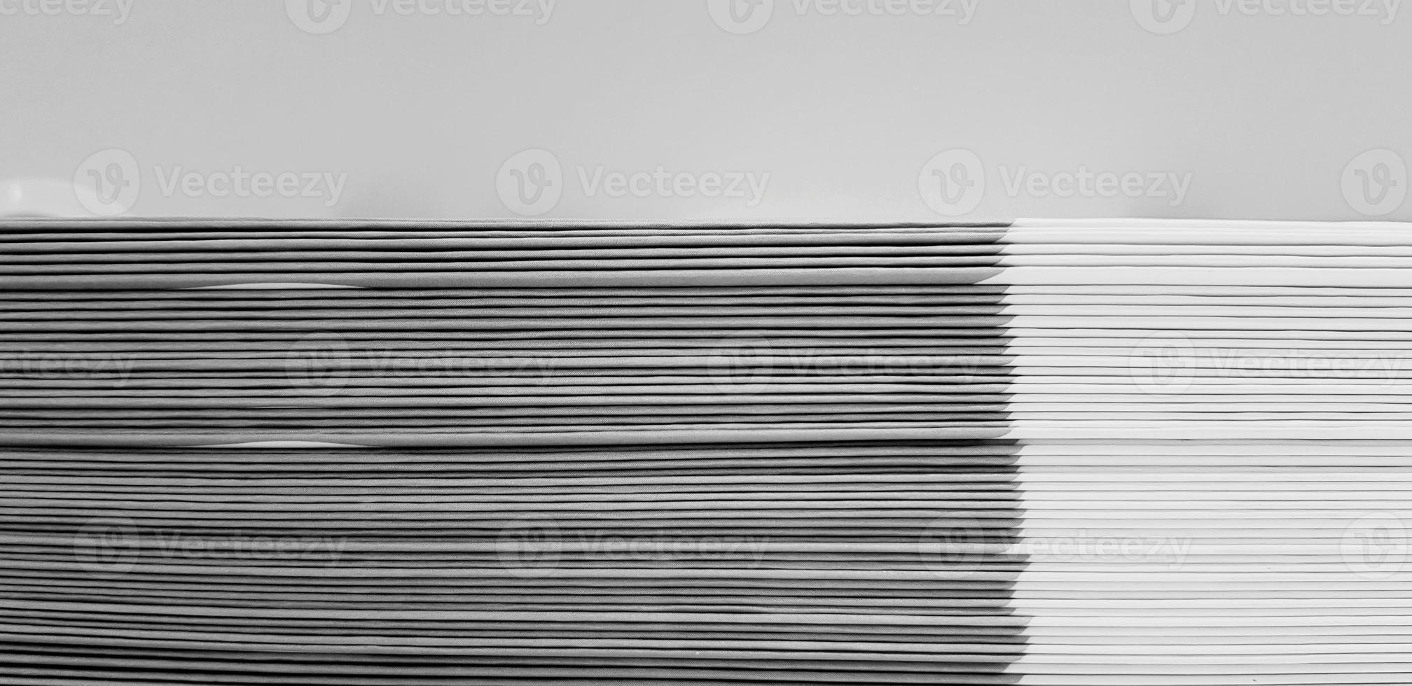 Close up pattern and line of white and black spine or saddle book are sorting and stacking for background with above space. Art group of object, Education and Library concept photo