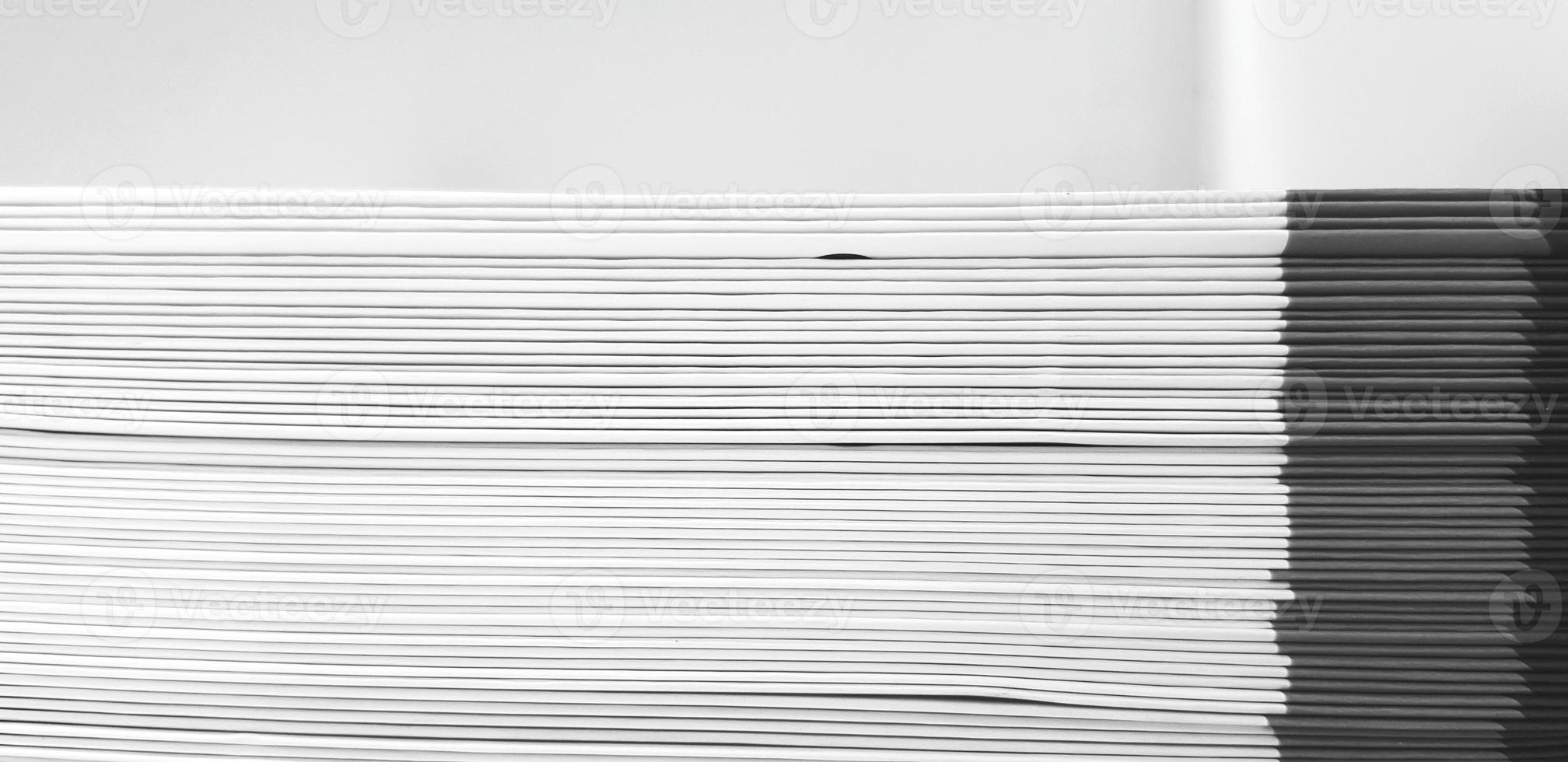 Close up pattern and line of white and black spine or saddle book are sorting and stacking for background with above space. Art group of object, Education and Library concept photo
