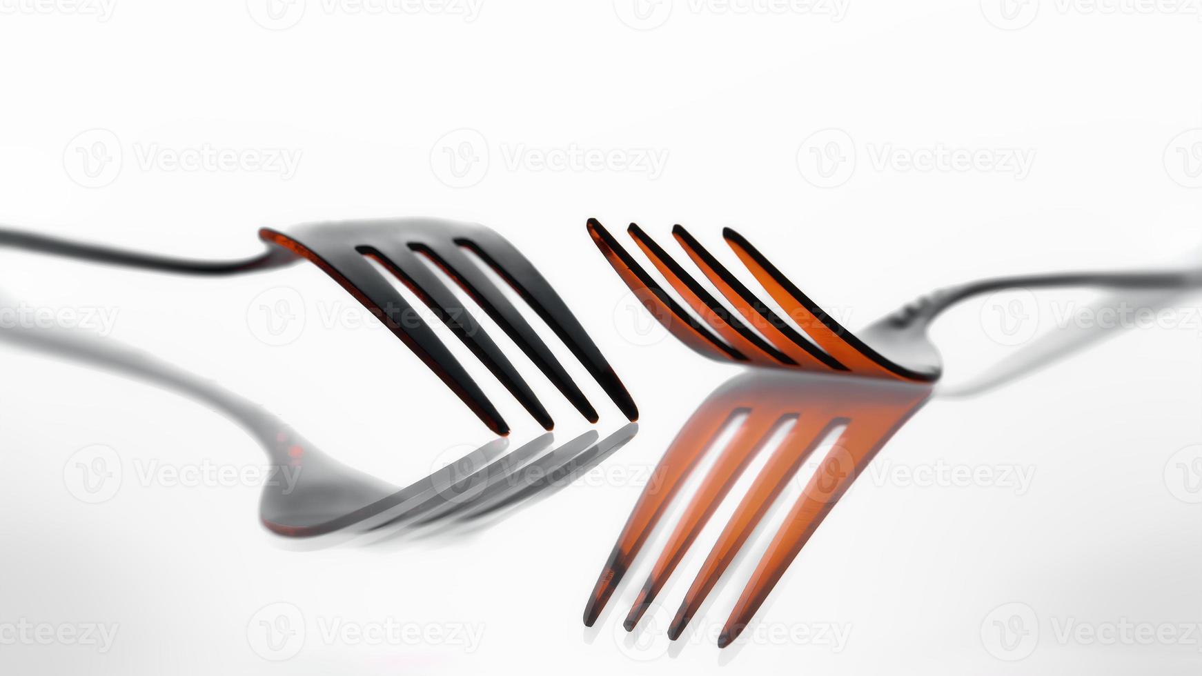 Two metal fork with reflection photo