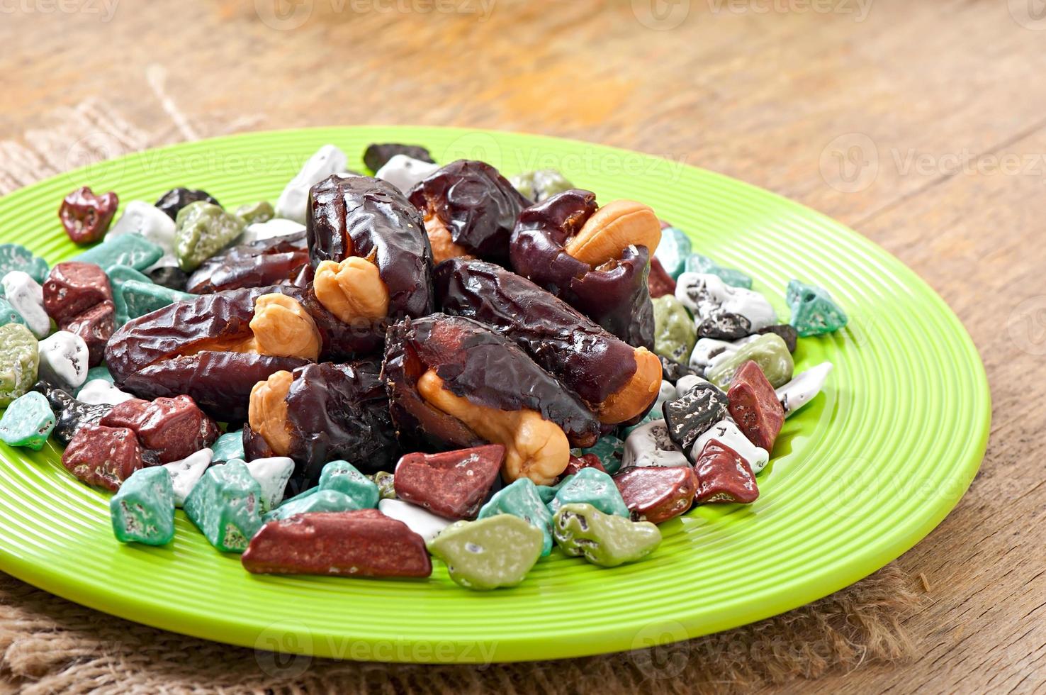 Eastern sweets on grenn plate photo