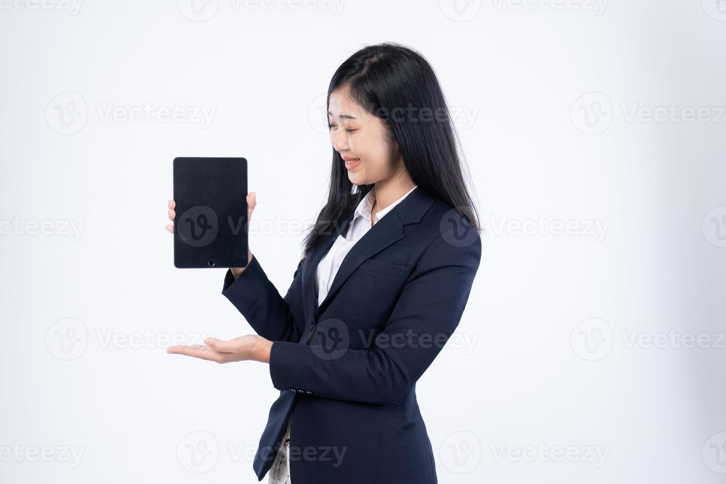 Portrait of corporate woman reads news, works on her digital tablet while on her way to office, Business woman portrait, holding a tablet in his hand photo