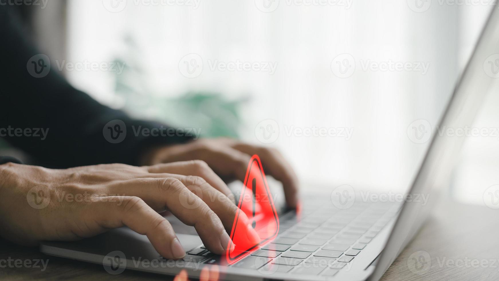 Computer notification error maintenance concept. programmer, or developer using a computer laptop with a triangle warning exclamation red sign trouble caution. photo