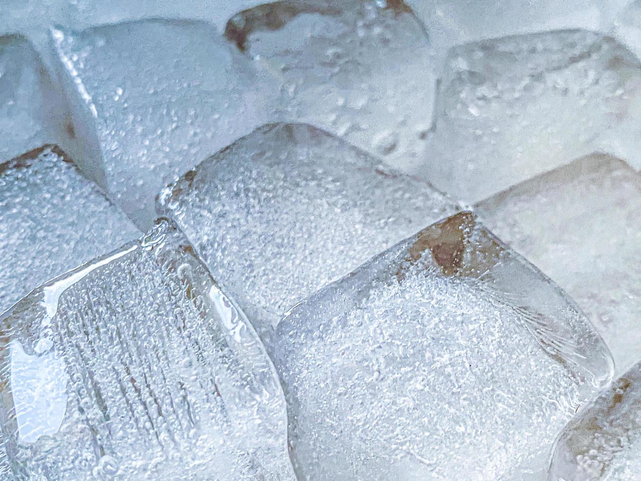 Ice cubes background, ice cube texture or background It makes me feel fresh and feel good, In the summer, ice and cold drinks will make us feel relaxed, Made for beverage or refreshment business. photo