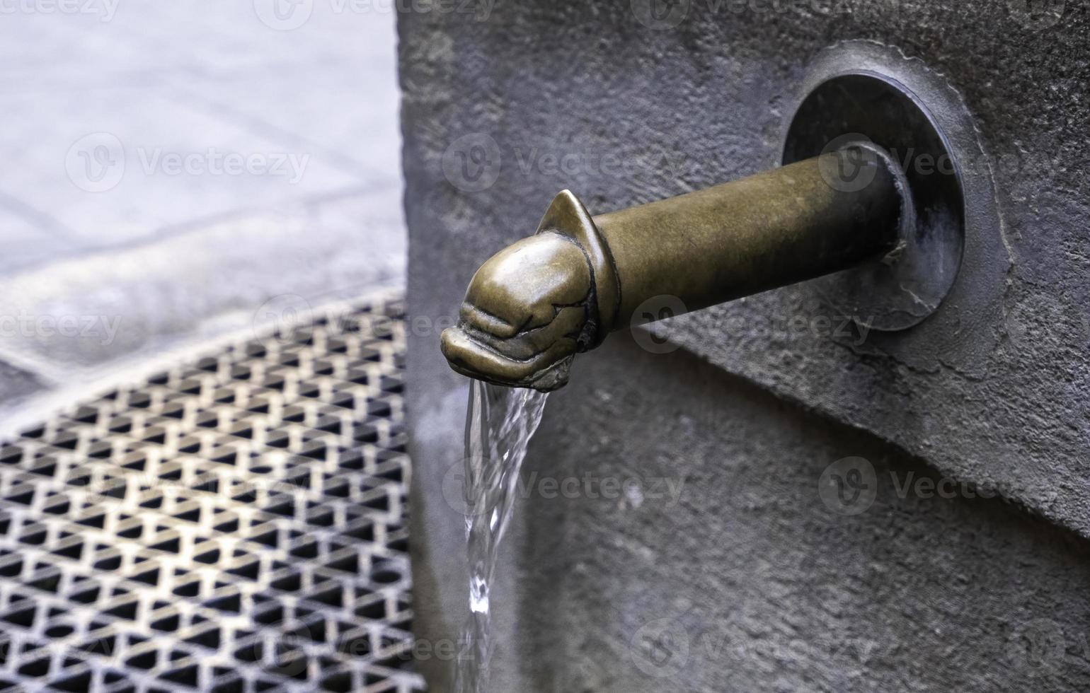 Old fountain with water photo