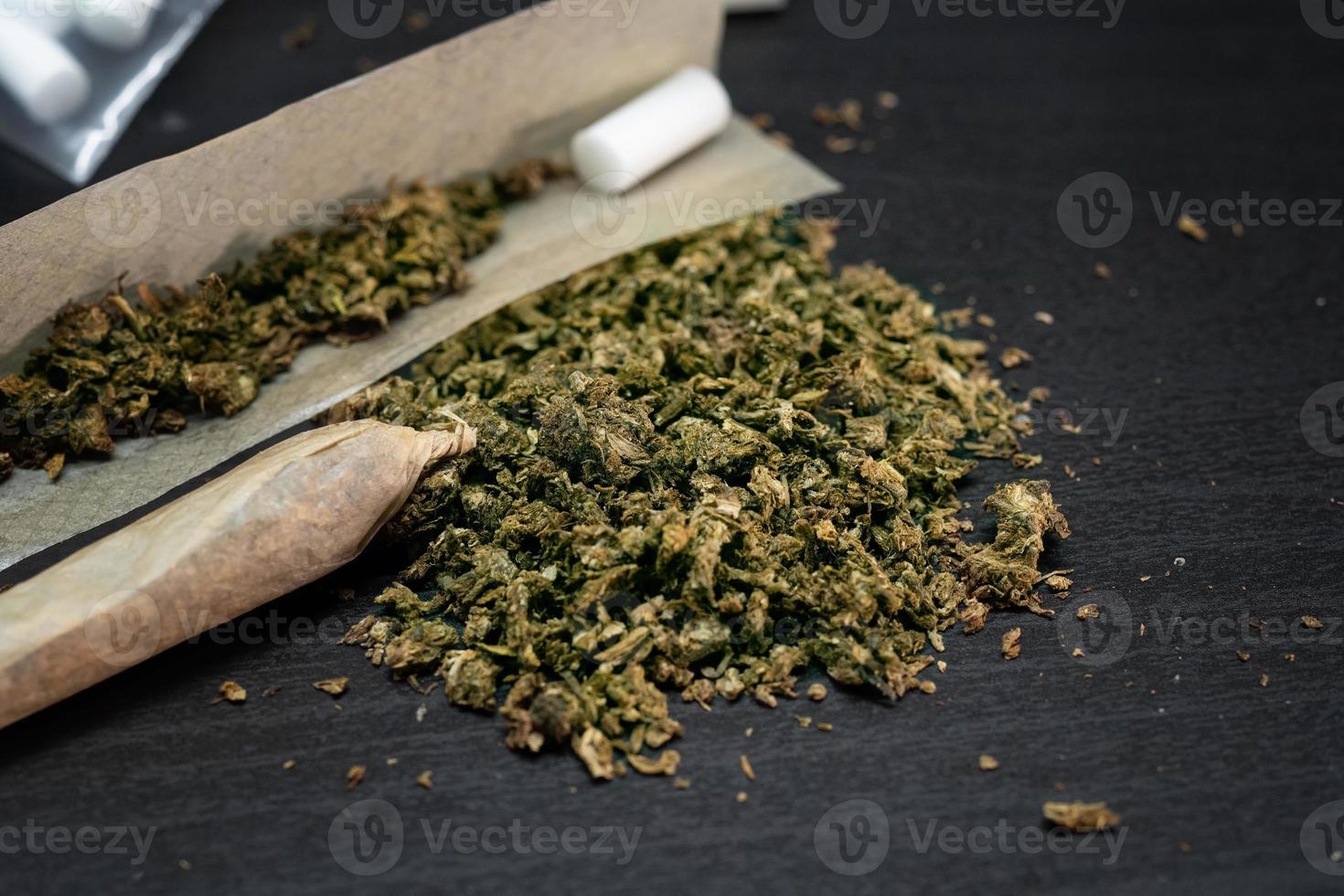 Close up of marijuana, Cannabis Indica on wooden background.Drugs narcotic concept. photo