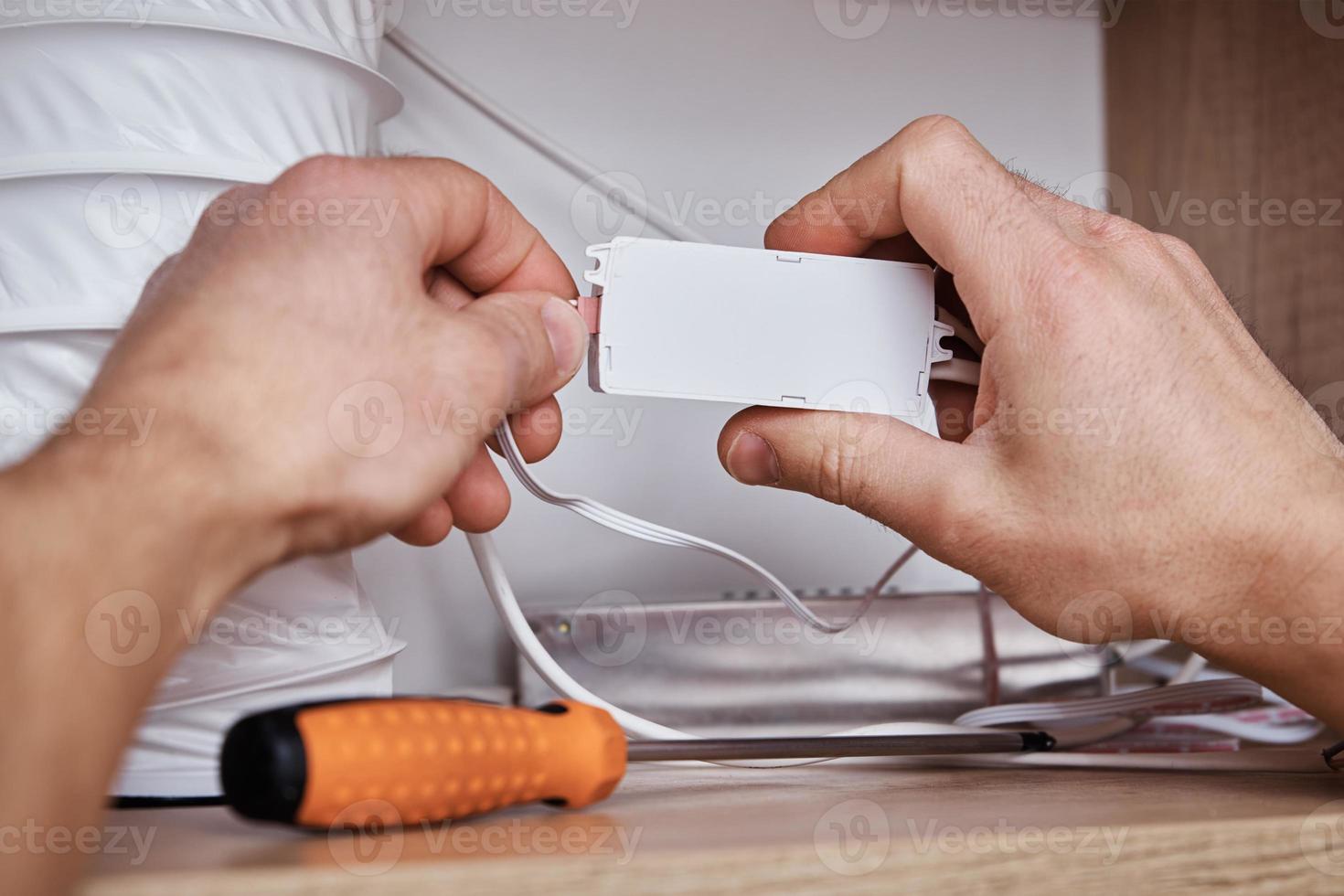 Connecting wiring in the kitchen cabinet photo