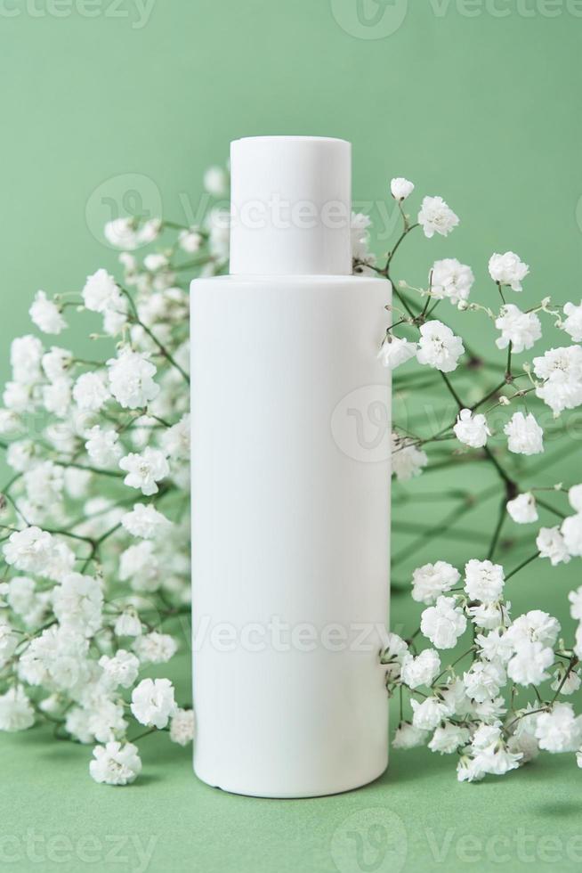 Cosmetics beauty mockup. White bottle on pastel background photo
