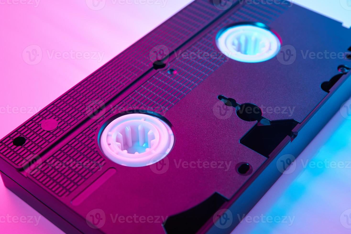 Video cassete on the color background. Retro vhs cassette tape photo