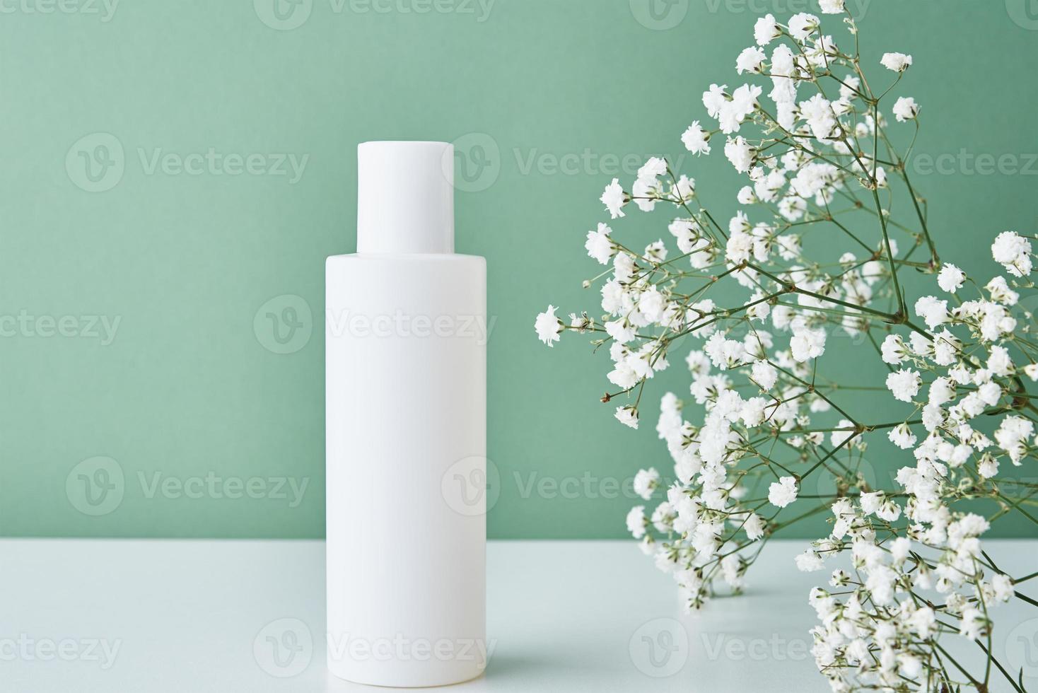Cosmetics beauty mockup. White bottle on pastel background photo