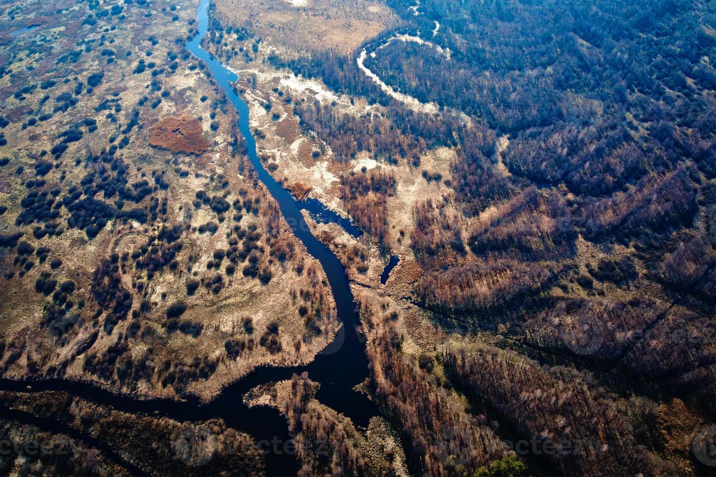 Overflowing river in the valley, aerial view photo