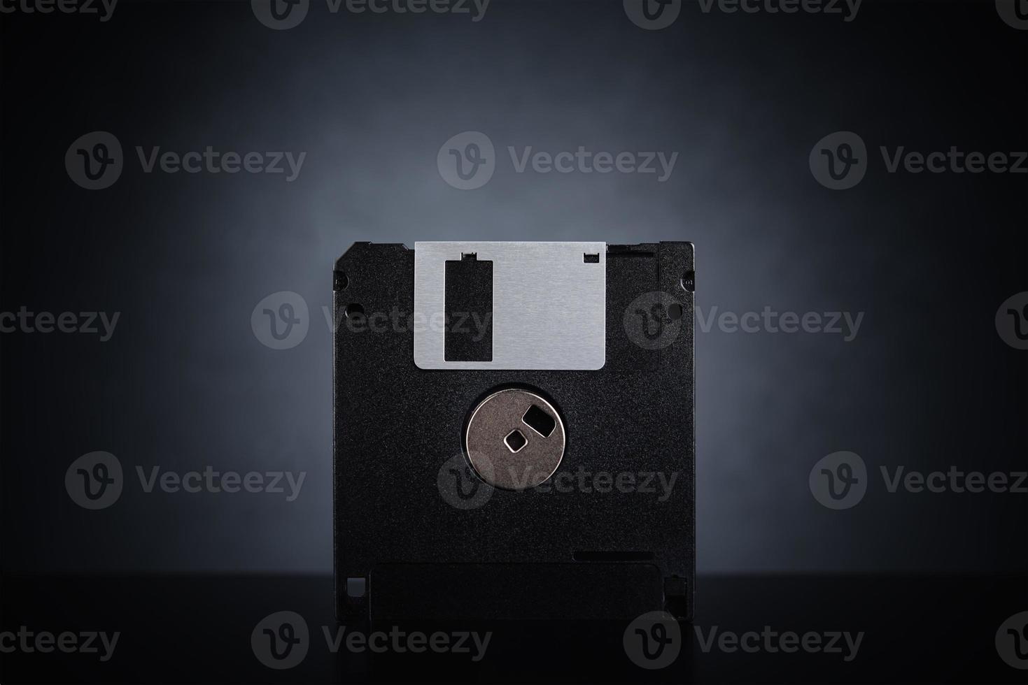 Floppy disk on dark background photo