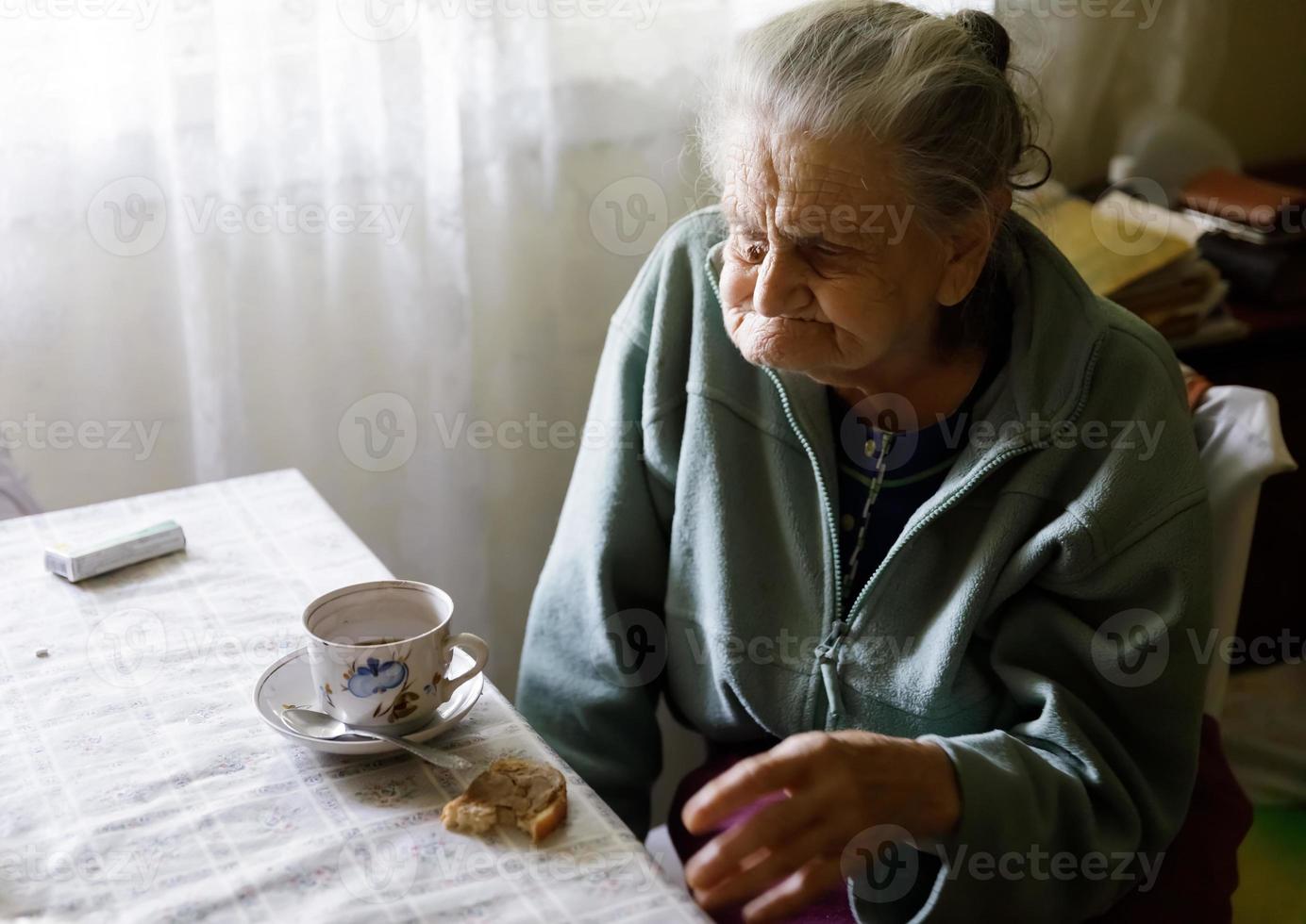 Elderly lonely woman photo