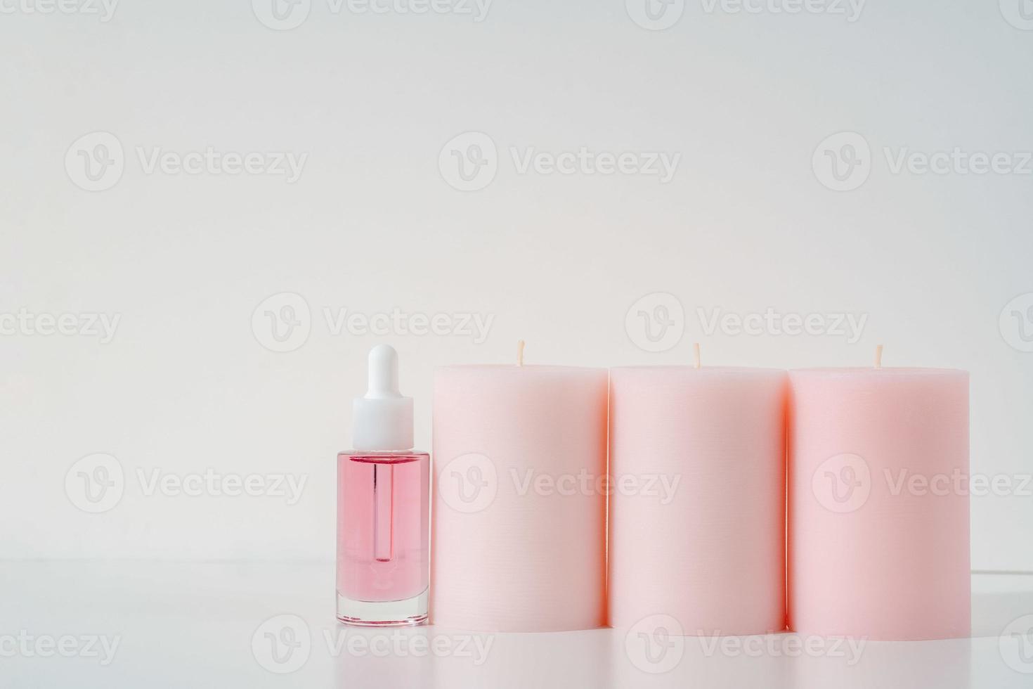 pink face oil and candles photo