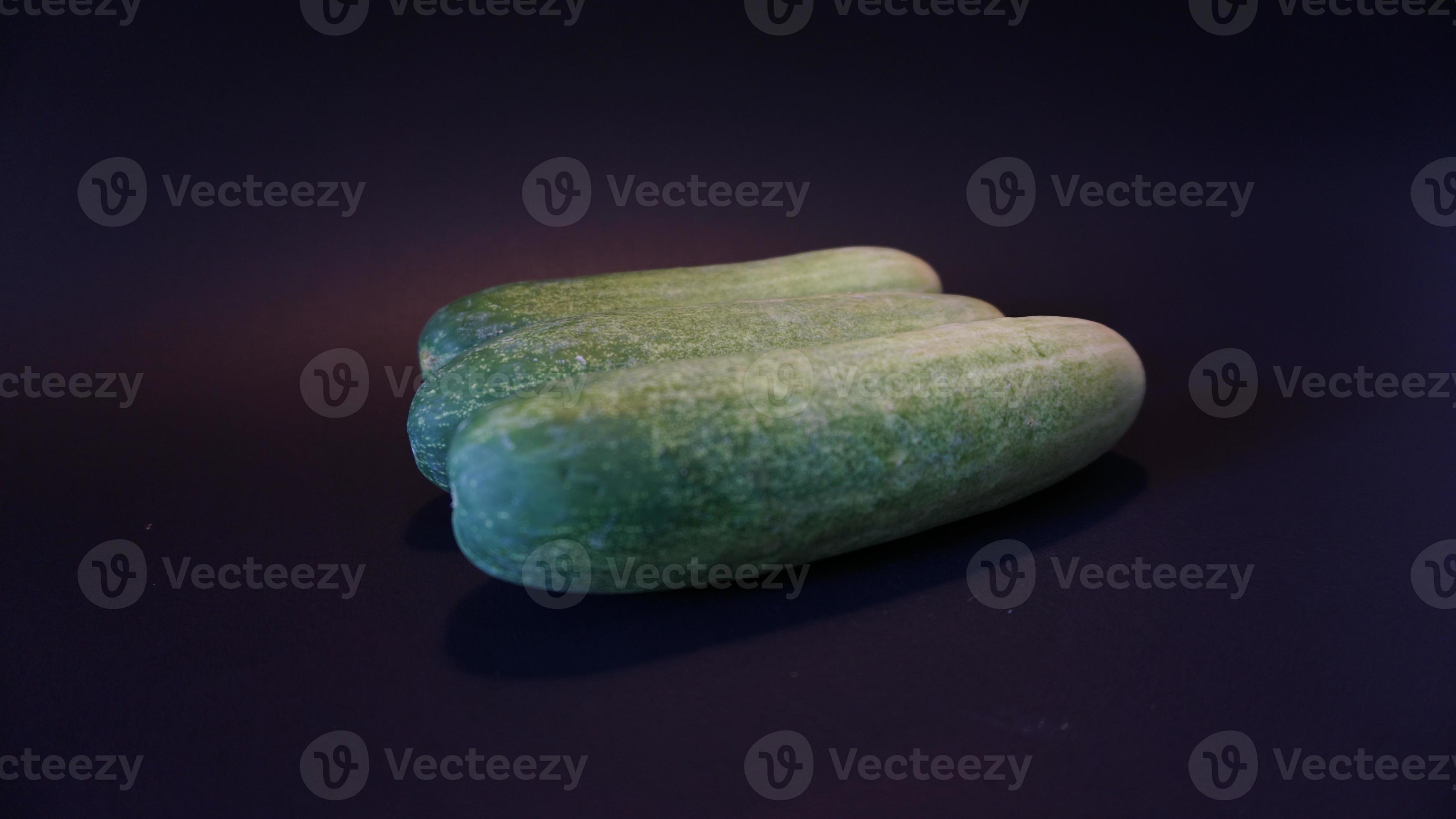 Fresh cucumber on black background. 18918561 Stock Photo at Vecteezy
